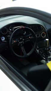 Close-up of a car dashboard showing sport mode activation.