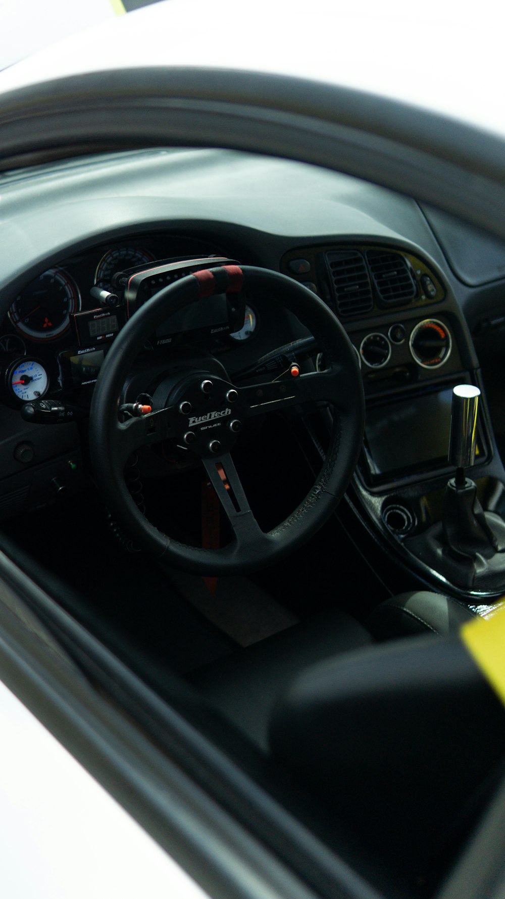 the interior of a car with a steering wheel