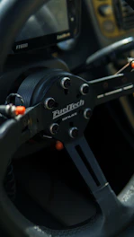 Thrustmaster T300 racing wheel with a custom Velocraft open wheel modification attached.