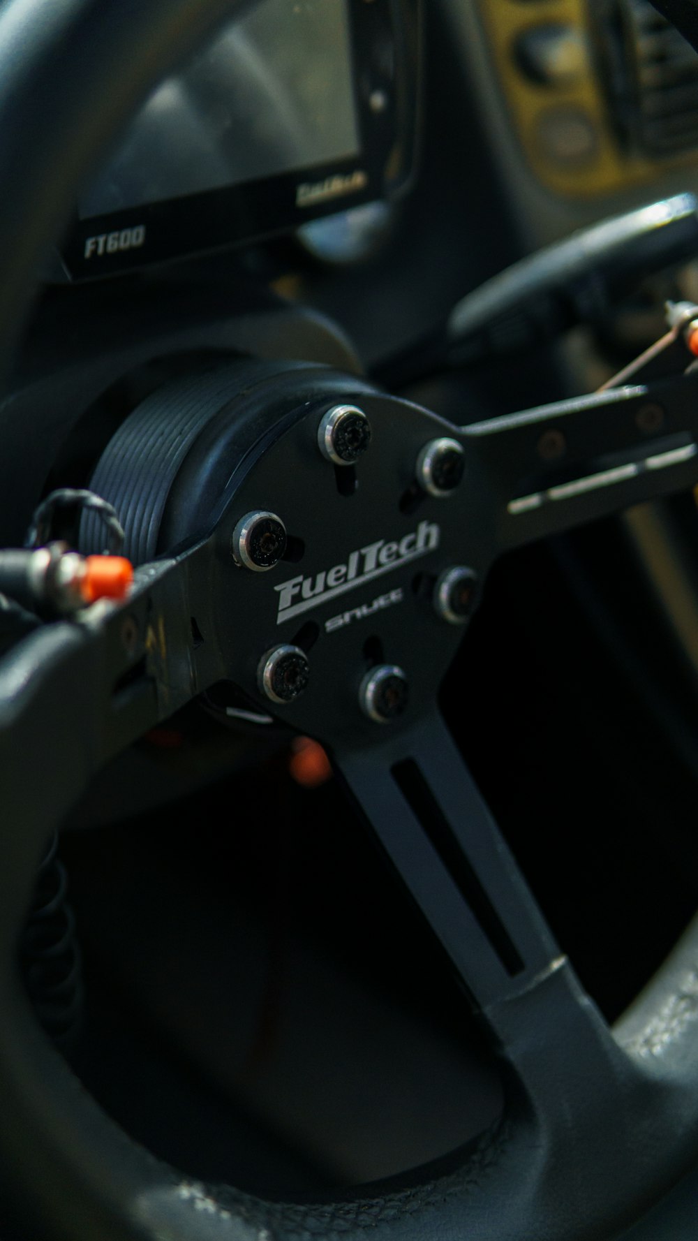 a close up of a steering wheel on a car