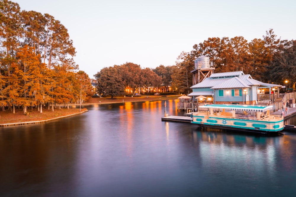 a houseboat is docked at the end of a river