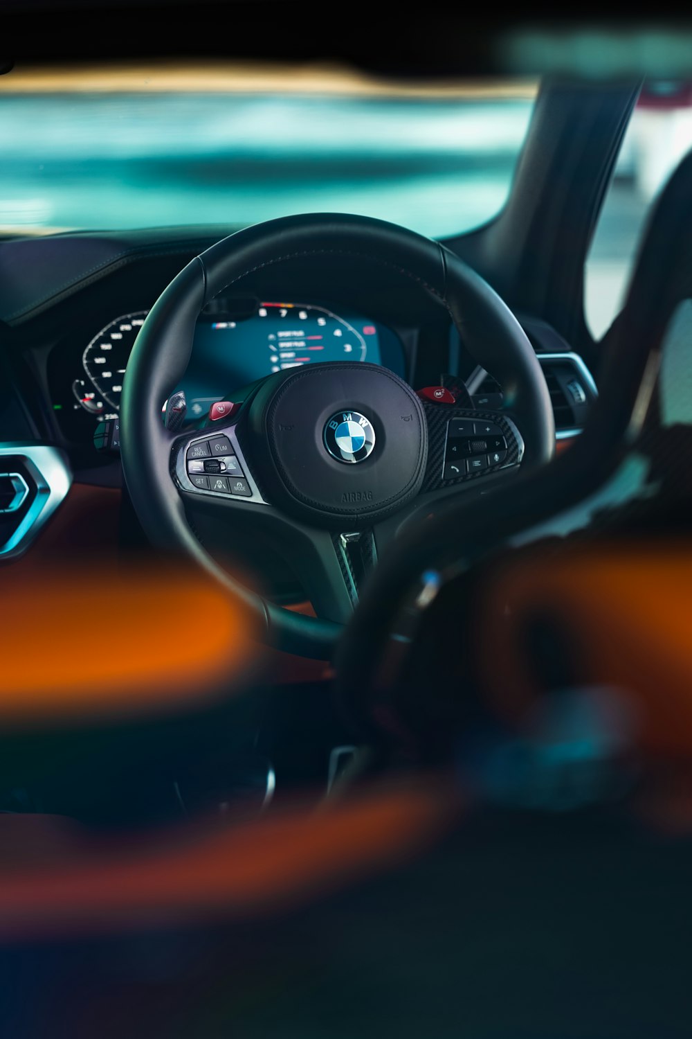 the interior of a car with a steering wheel and dashboard