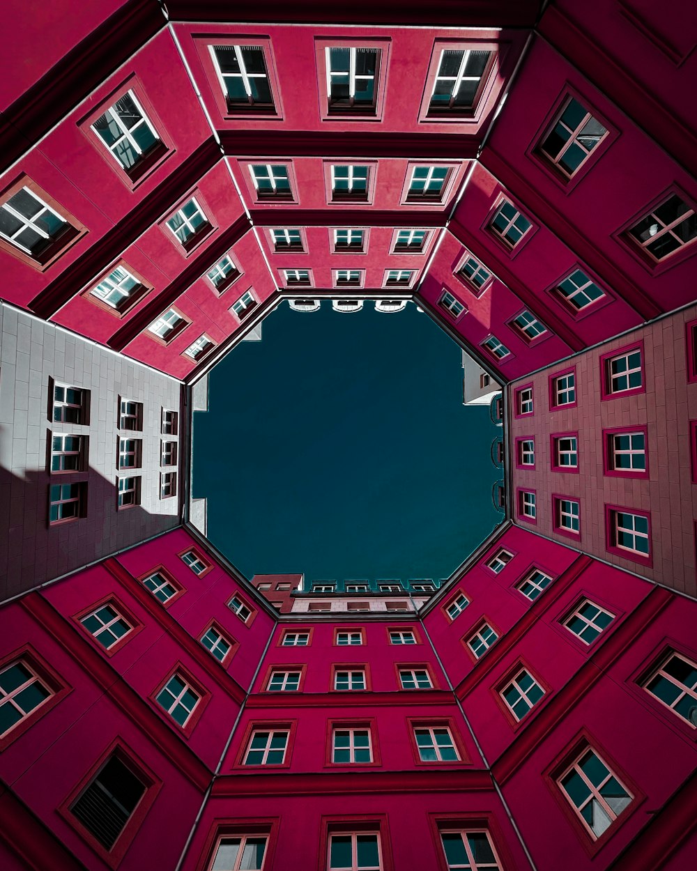 looking up at a red building from the ground