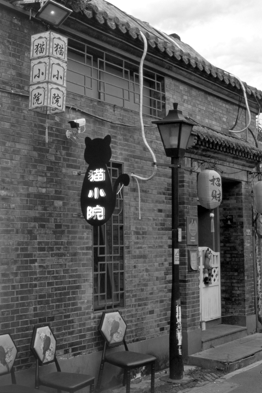 a black and white photo of a chinese restaurant