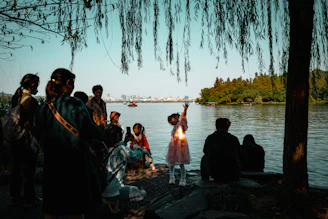 Families gathered at a lakeside event, engaging in fun and educational water safety activities.