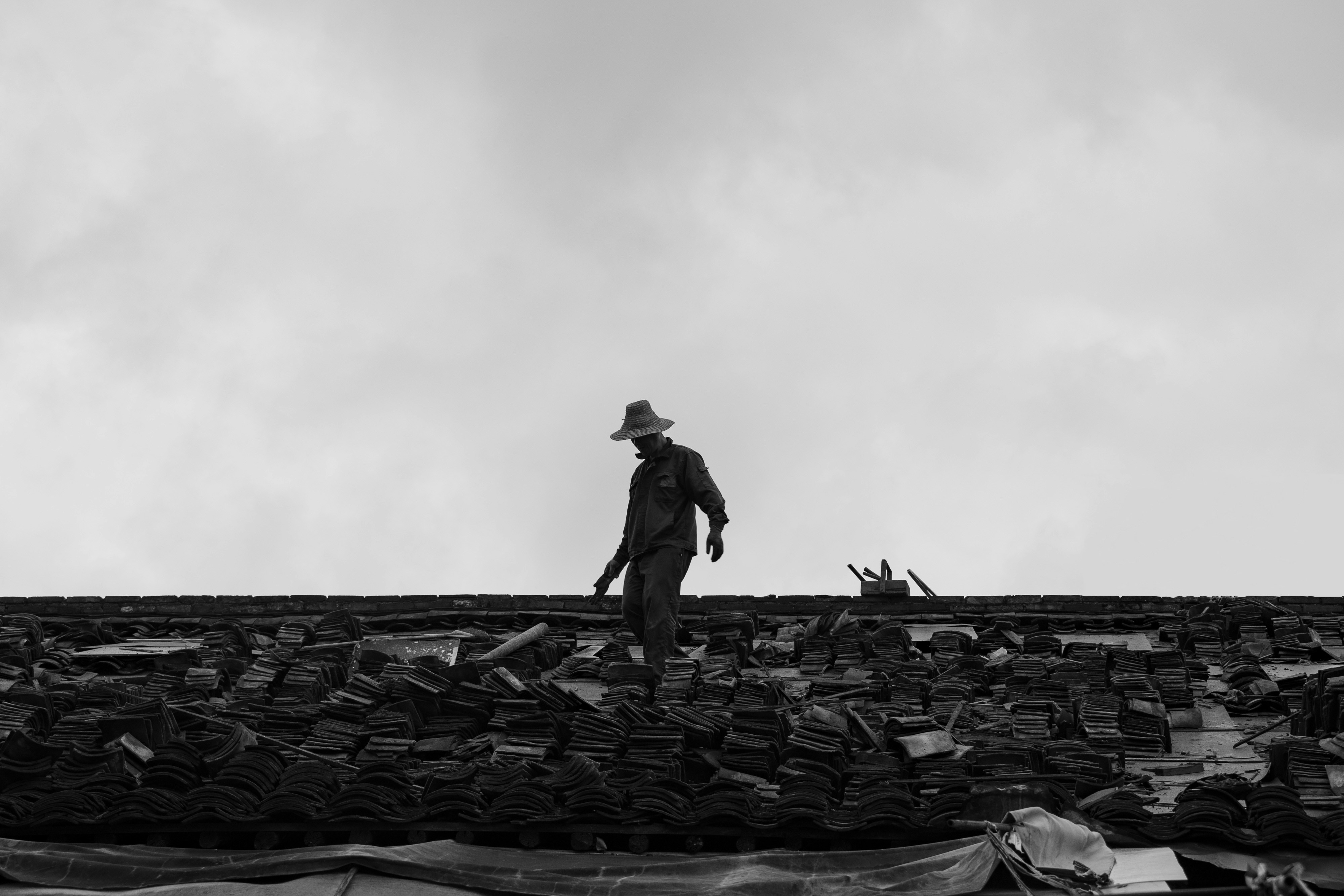 Roofing professional inspecting storm damage in Rogers AR - nwa roofing rogers ar