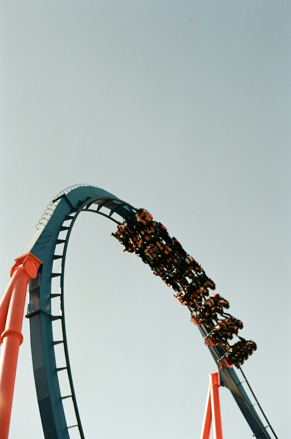 a roller coaster with people riding it