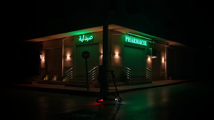A welcoming pharmacy storefront with a sign that reads 'Moataz Pharmacy'.