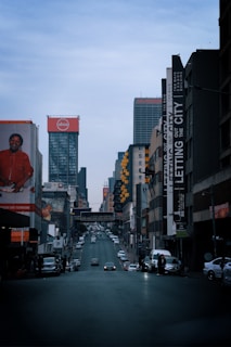 a city street filled with lots of tall buildings