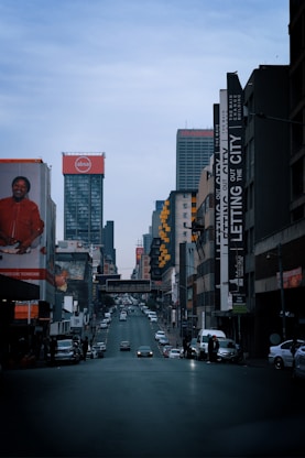 a city street filled with lots of tall buildings
