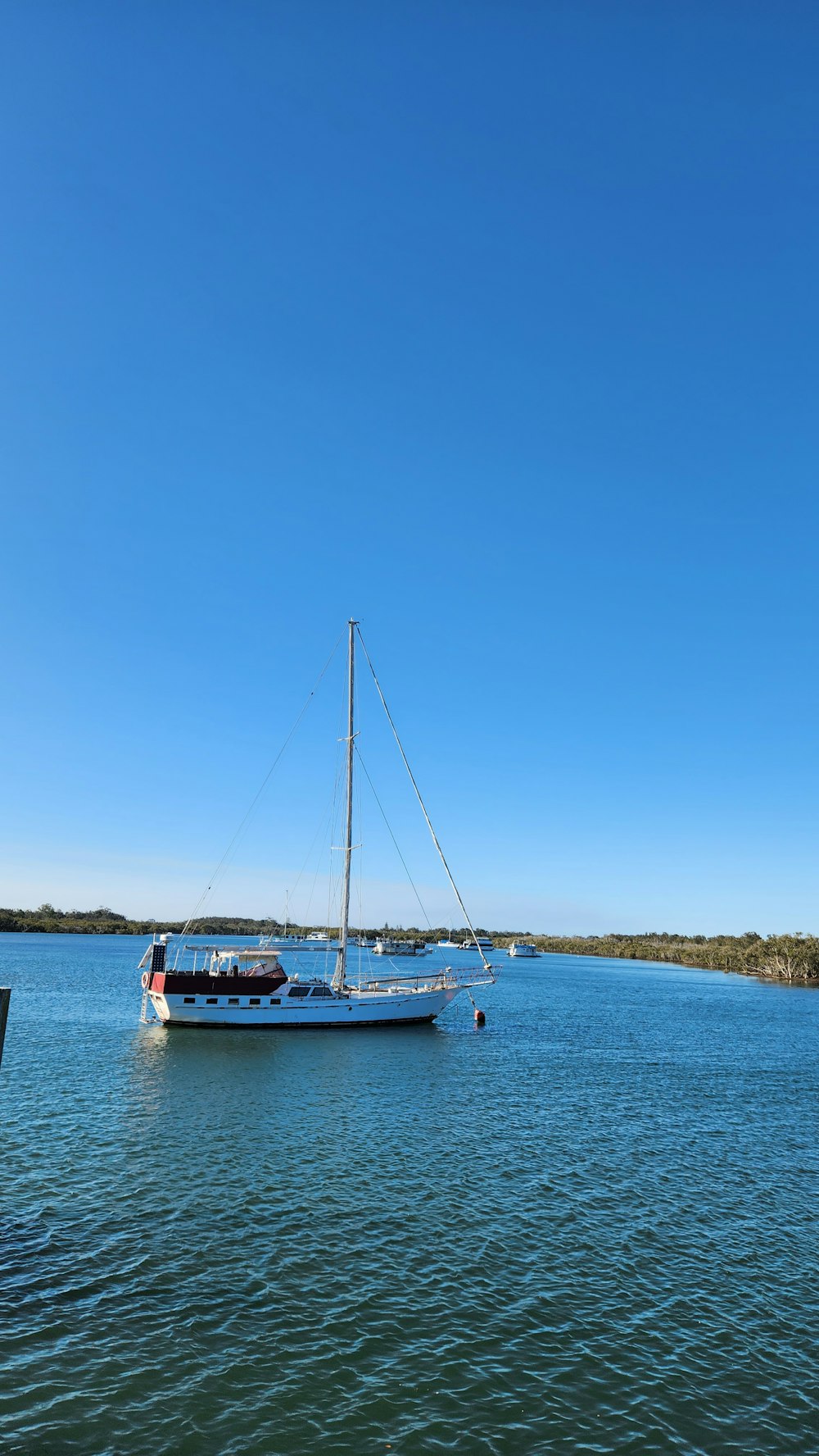 a boat floating on top of a large body of water