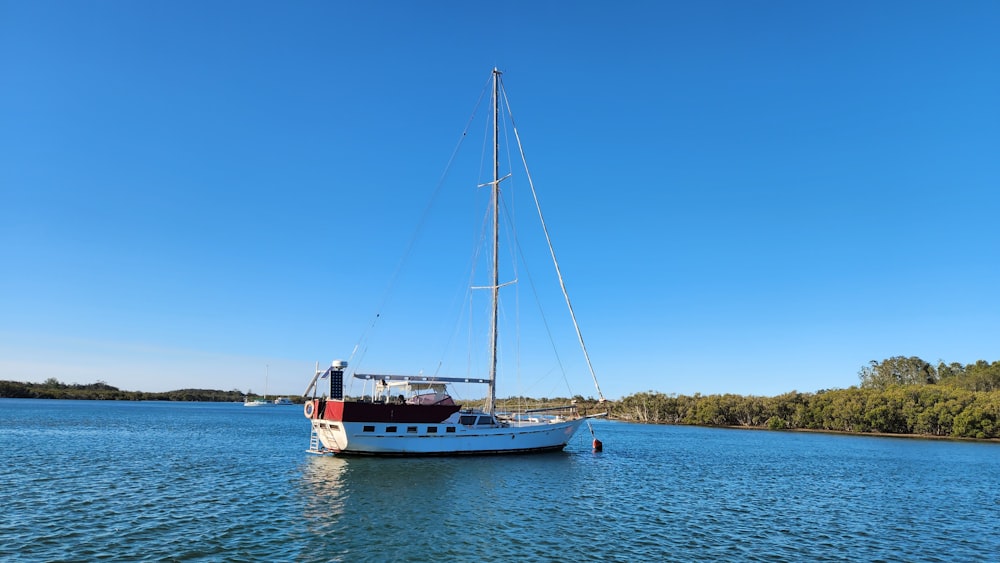 a sailboat floating on top of a large body of water