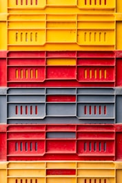 a large stack of yellow and red boxes