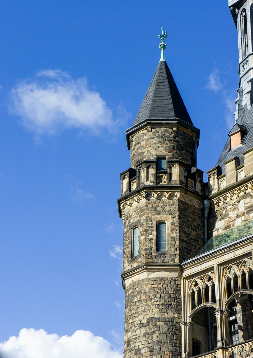 a very tall tower with a clock on it's side