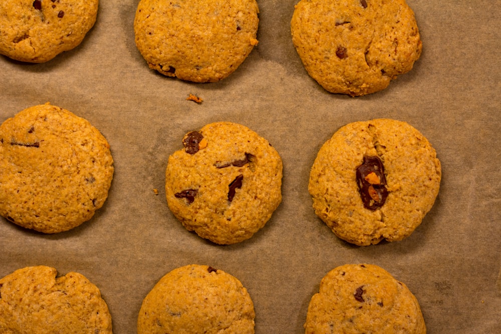 a bunch of cookies sitting on top of a baking sheet