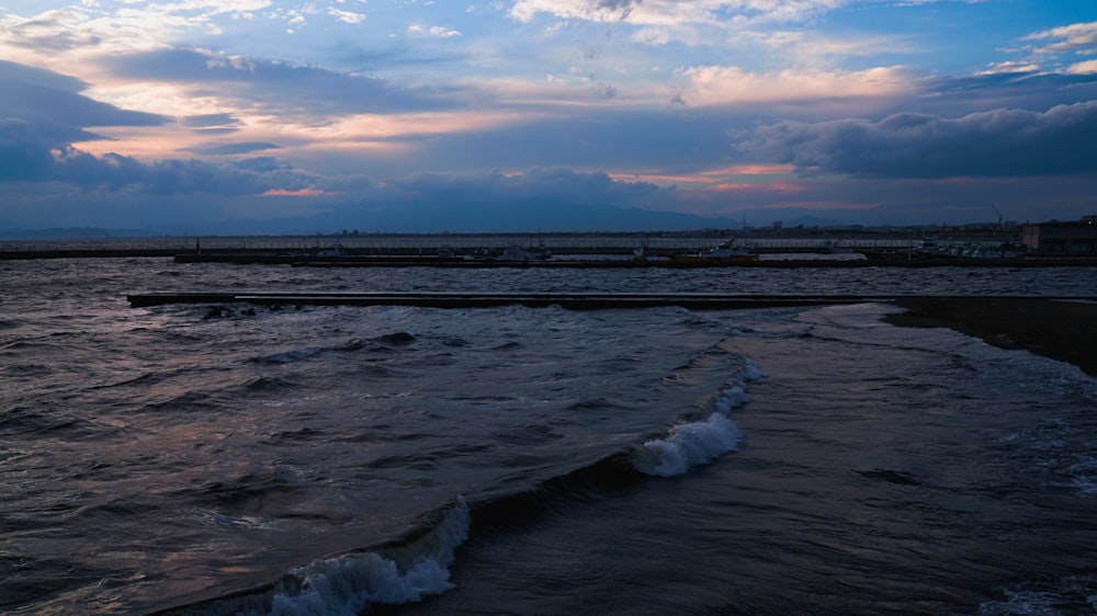 a body of water with waves coming in to shore