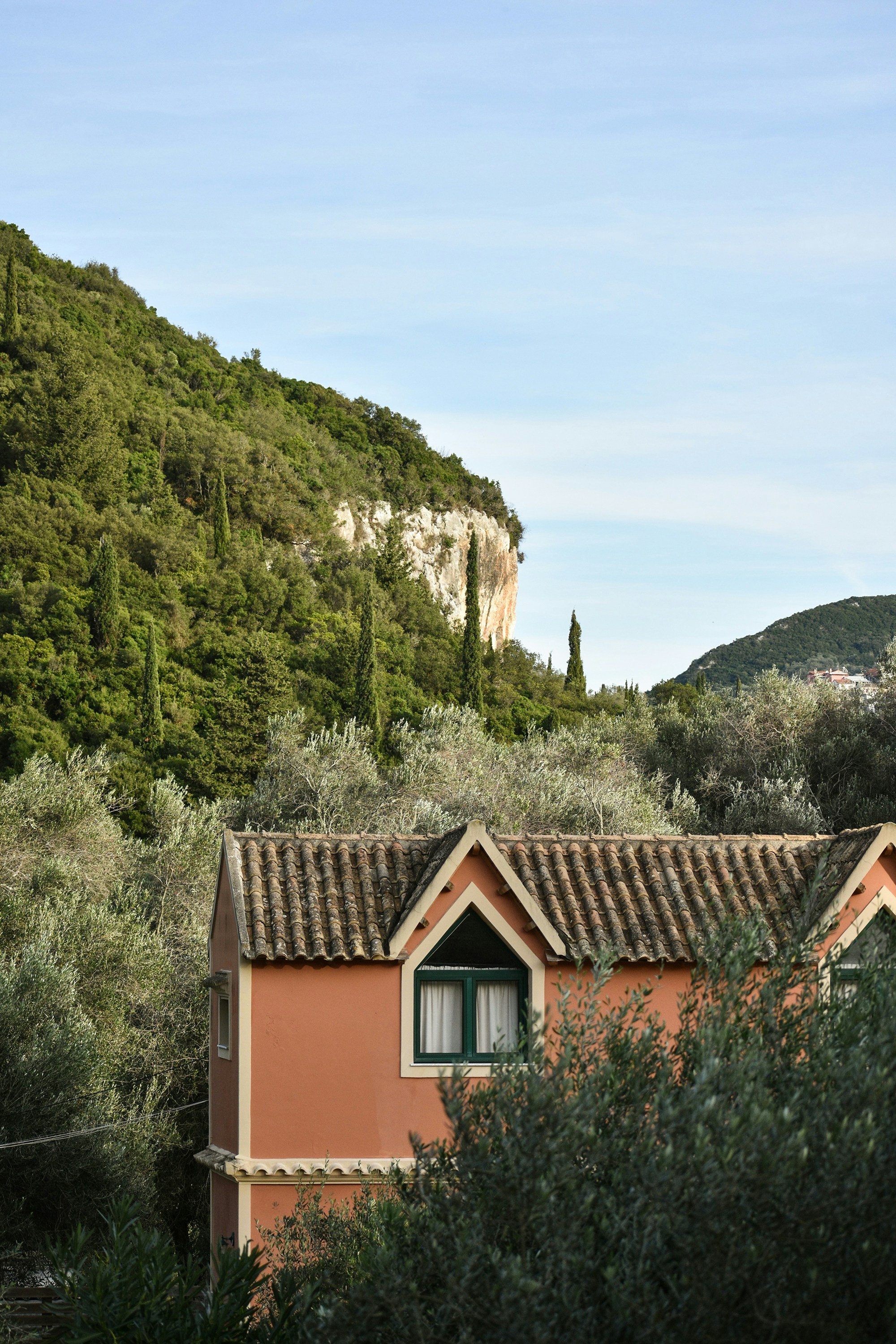 a house with a mountain in the background