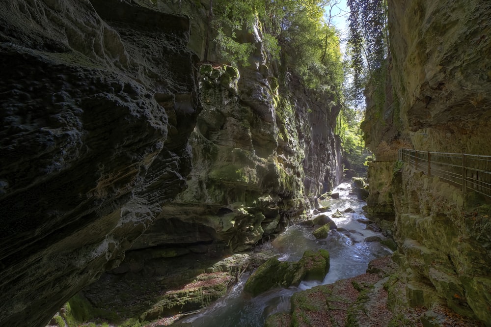 a narrow river running through a rocky canyon