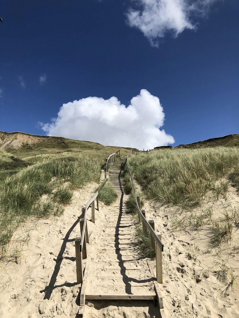 a set of stairs leading to the top of a hill