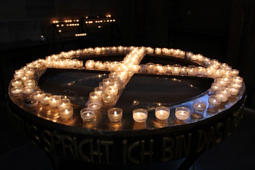 A collection of candles arranged in a circle, each representing a different moon phase.