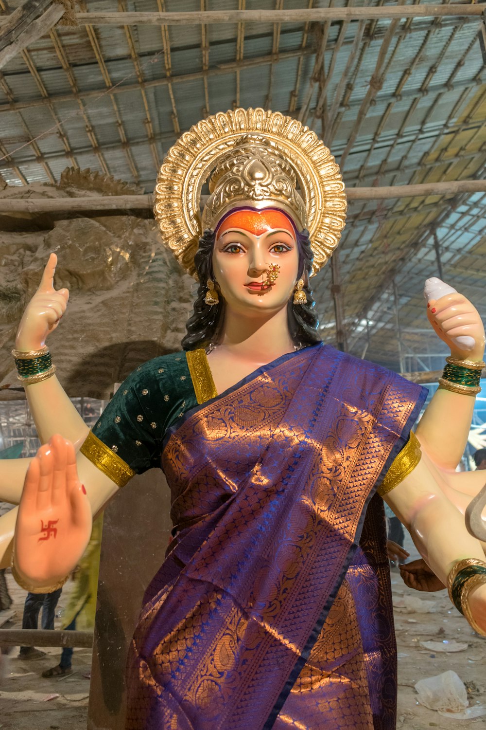 a statue of a woman in a purple sari