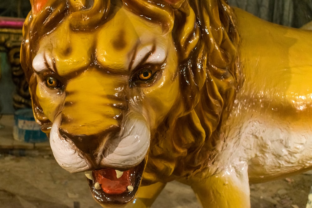 a close up of a statue of a lion