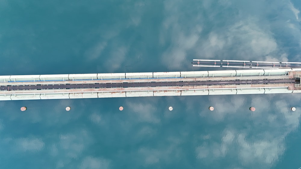 an aerial view of a bridge over a body of water