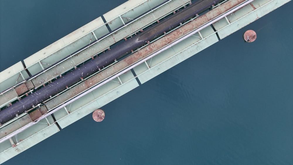an overhead view of a bridge over a body of water