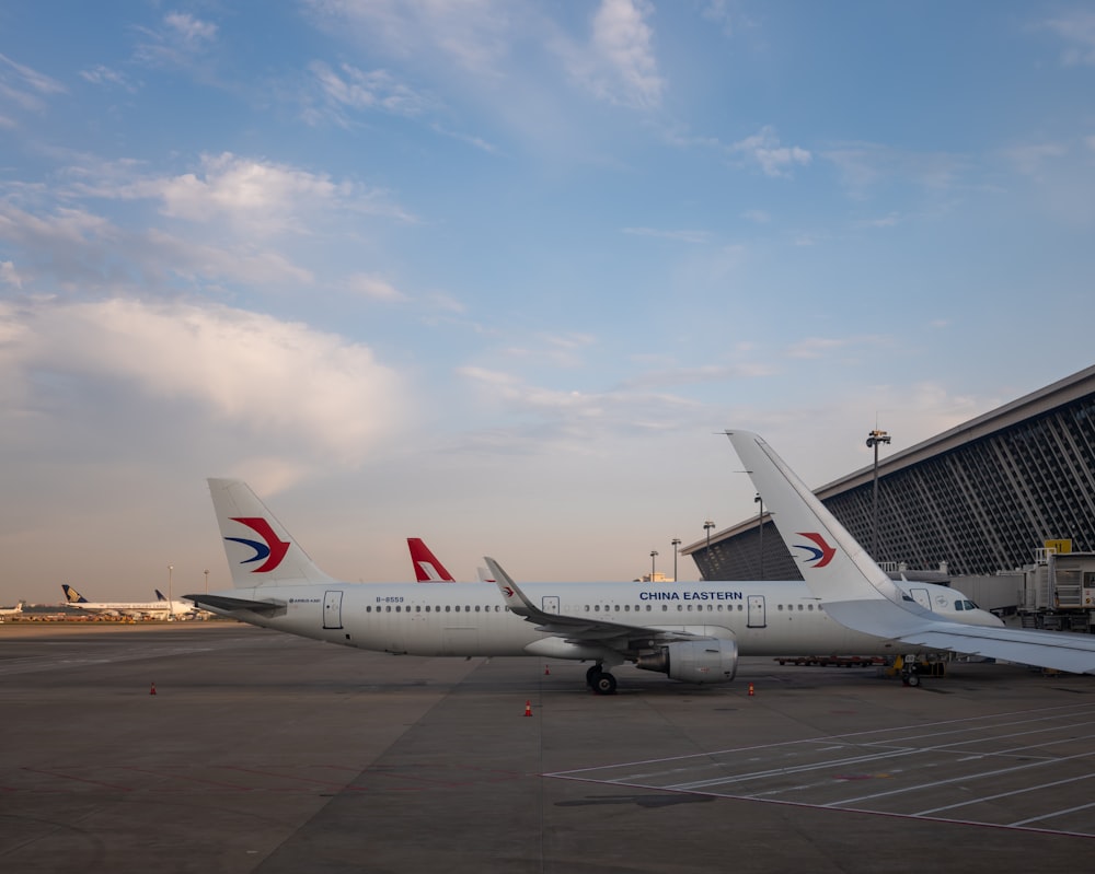 a large jetliner sitting on top of an airport tarmac