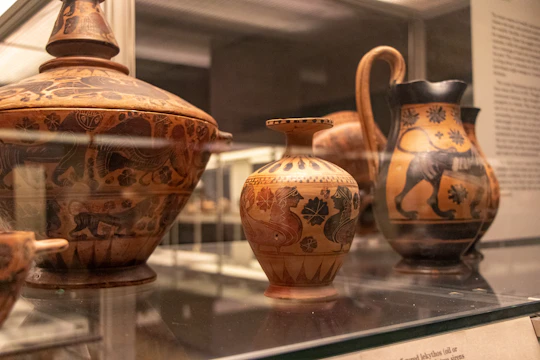An exhibit showcasing daily life artifacts including pottery, textiles, and traditional clothing from the viceregal period.