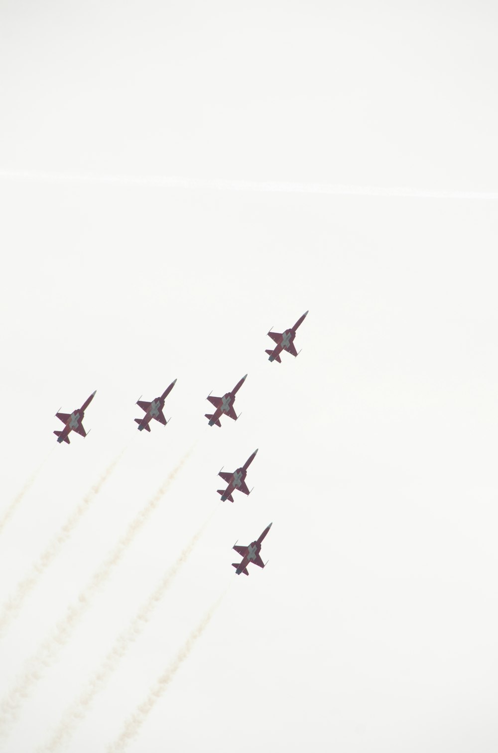 a group of jets flying in formation in the sky