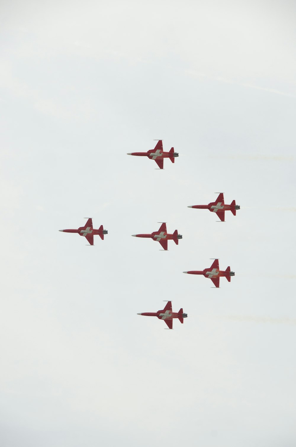 a group of fighter jets flying in formation