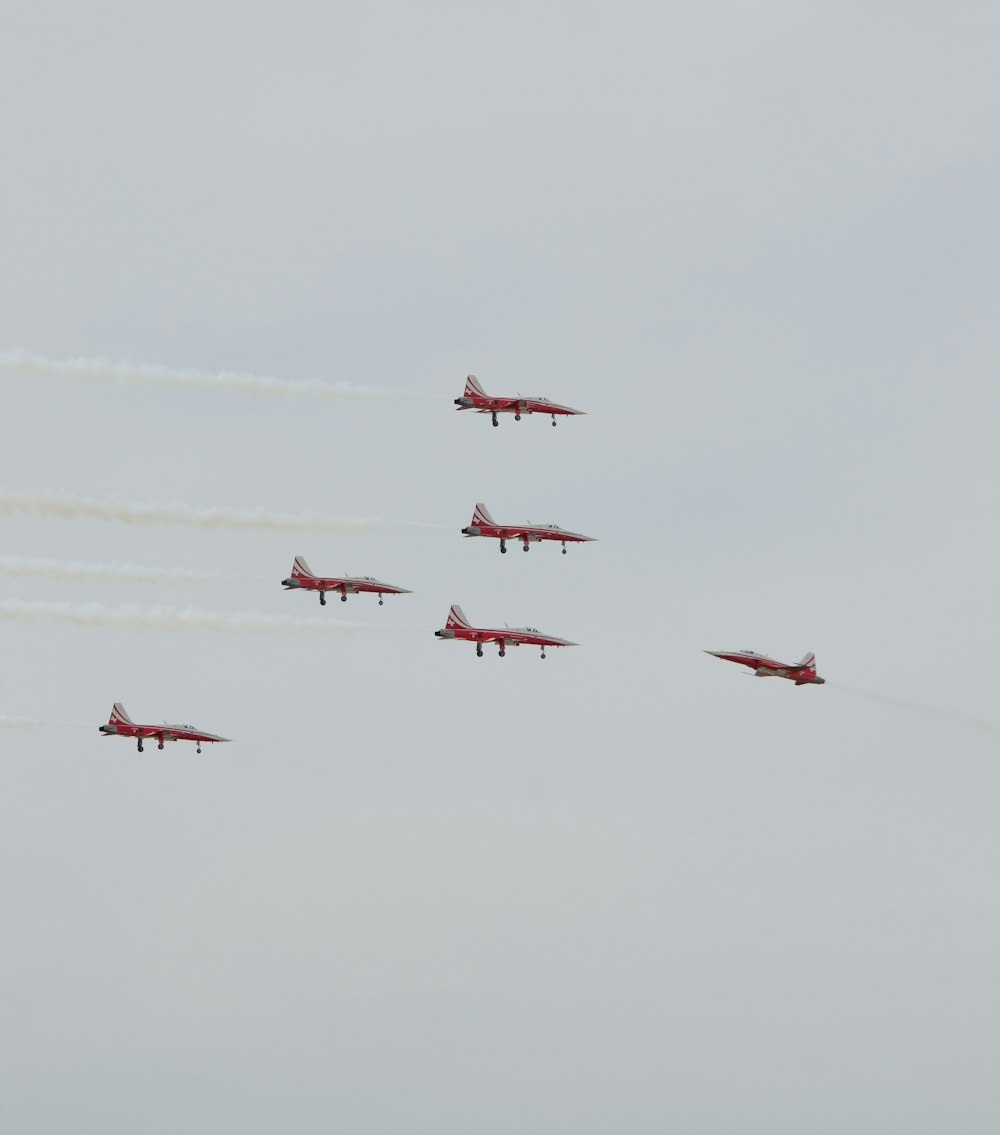 a group of airplanes flying in formation in the sky