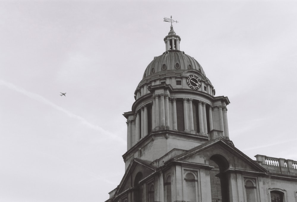 a black and white photo of a clock tower