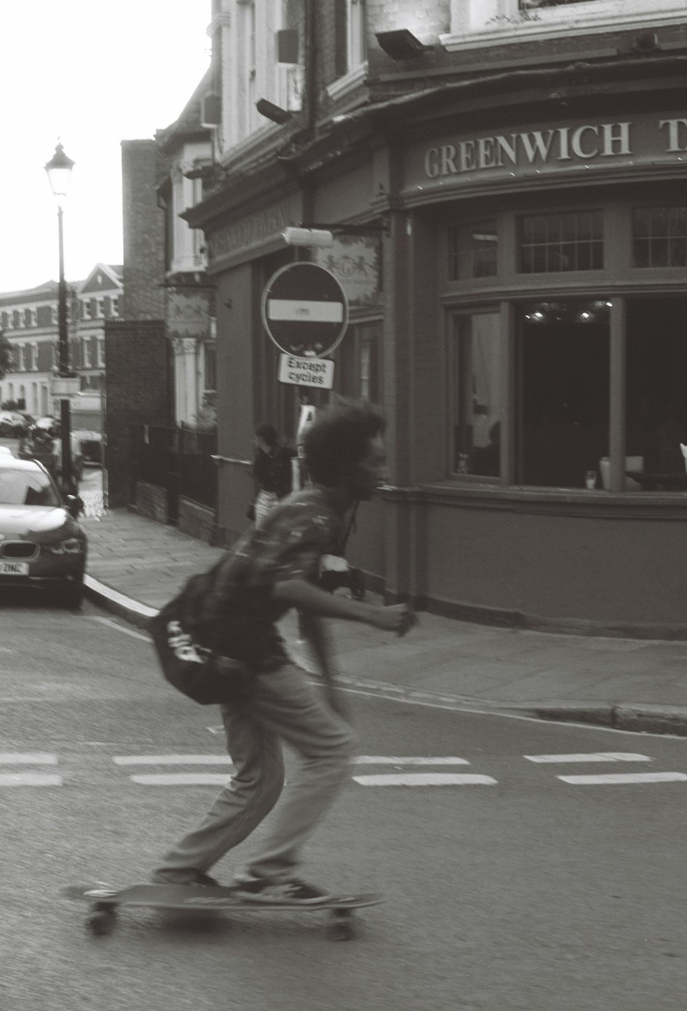 a person riding a skateboard down a street