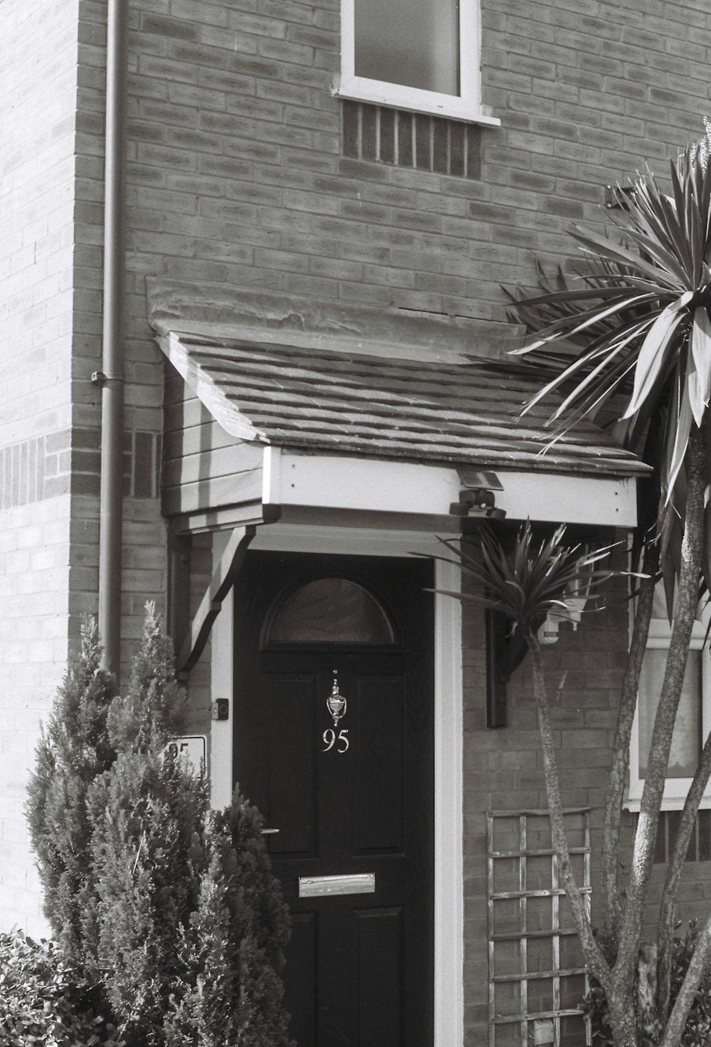 a black and white photo of a house