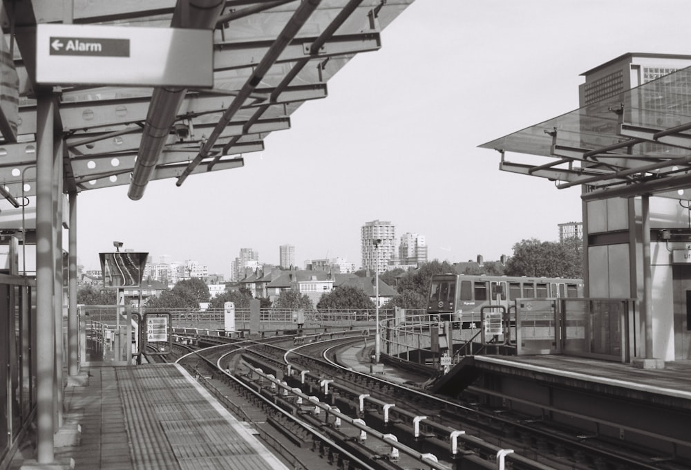 a black and white photo of a train station