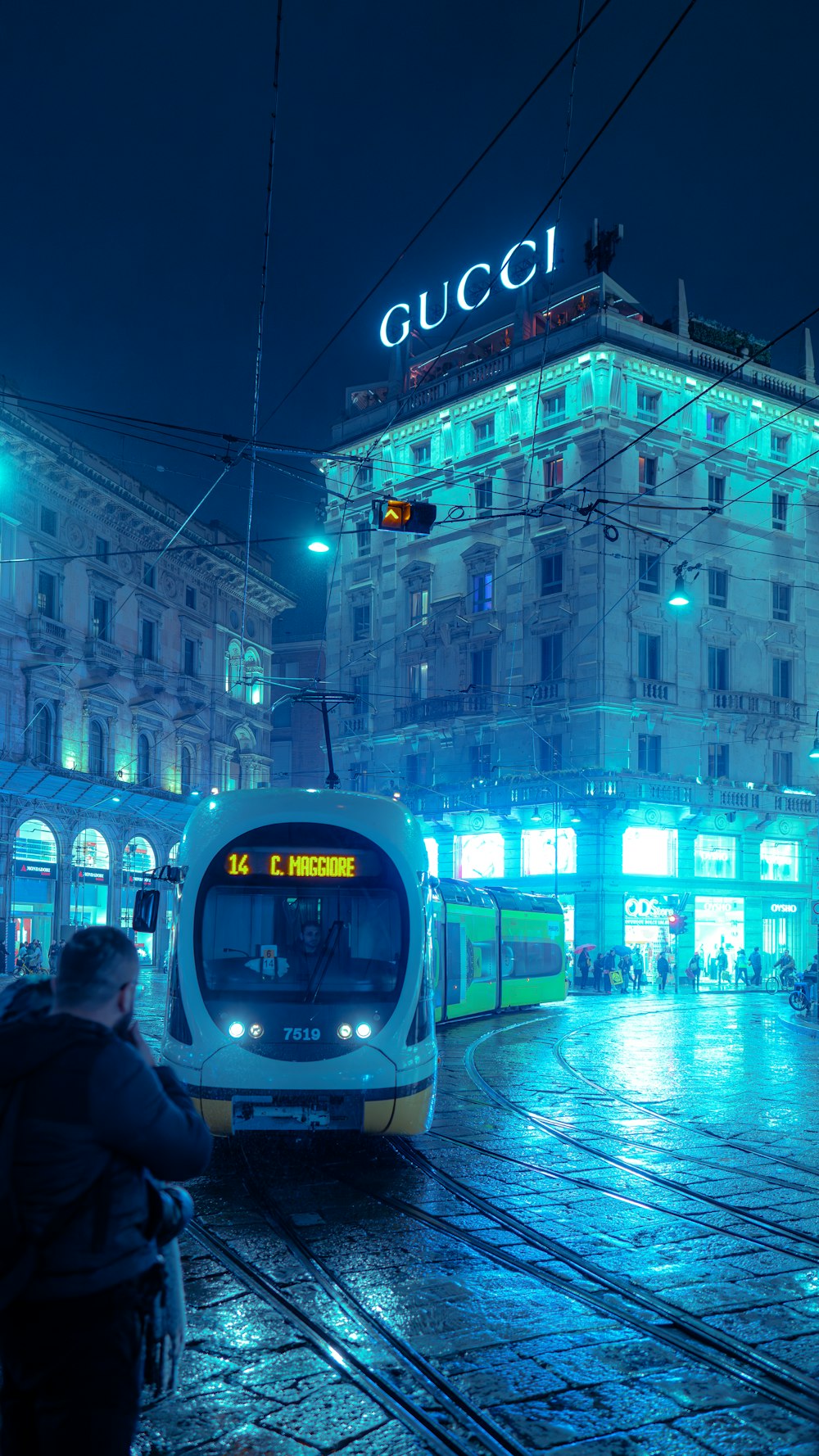 a train on a track in a city at night