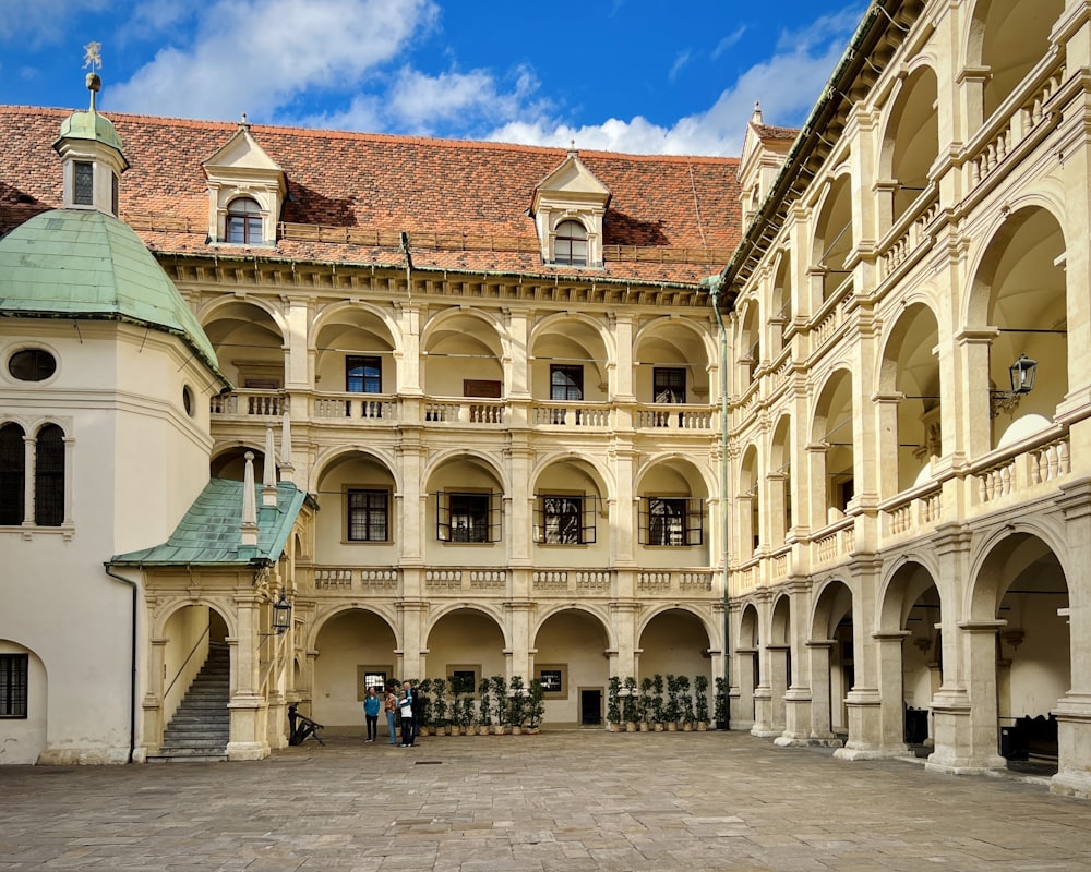 a courtyard of a building with a clock tower