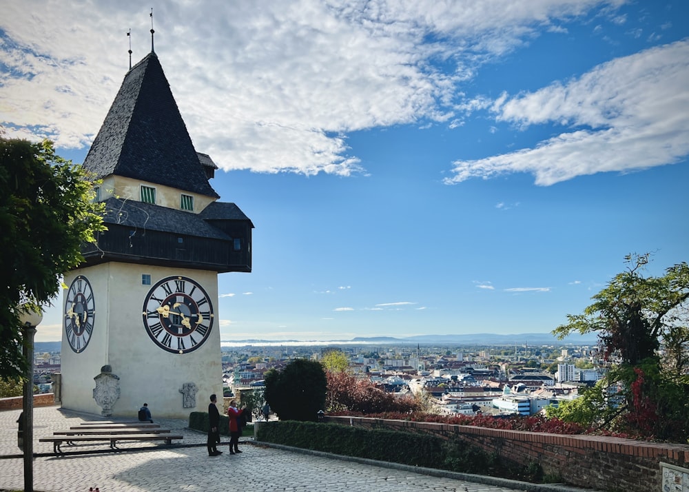 a clock tower on top of a building with a sky background