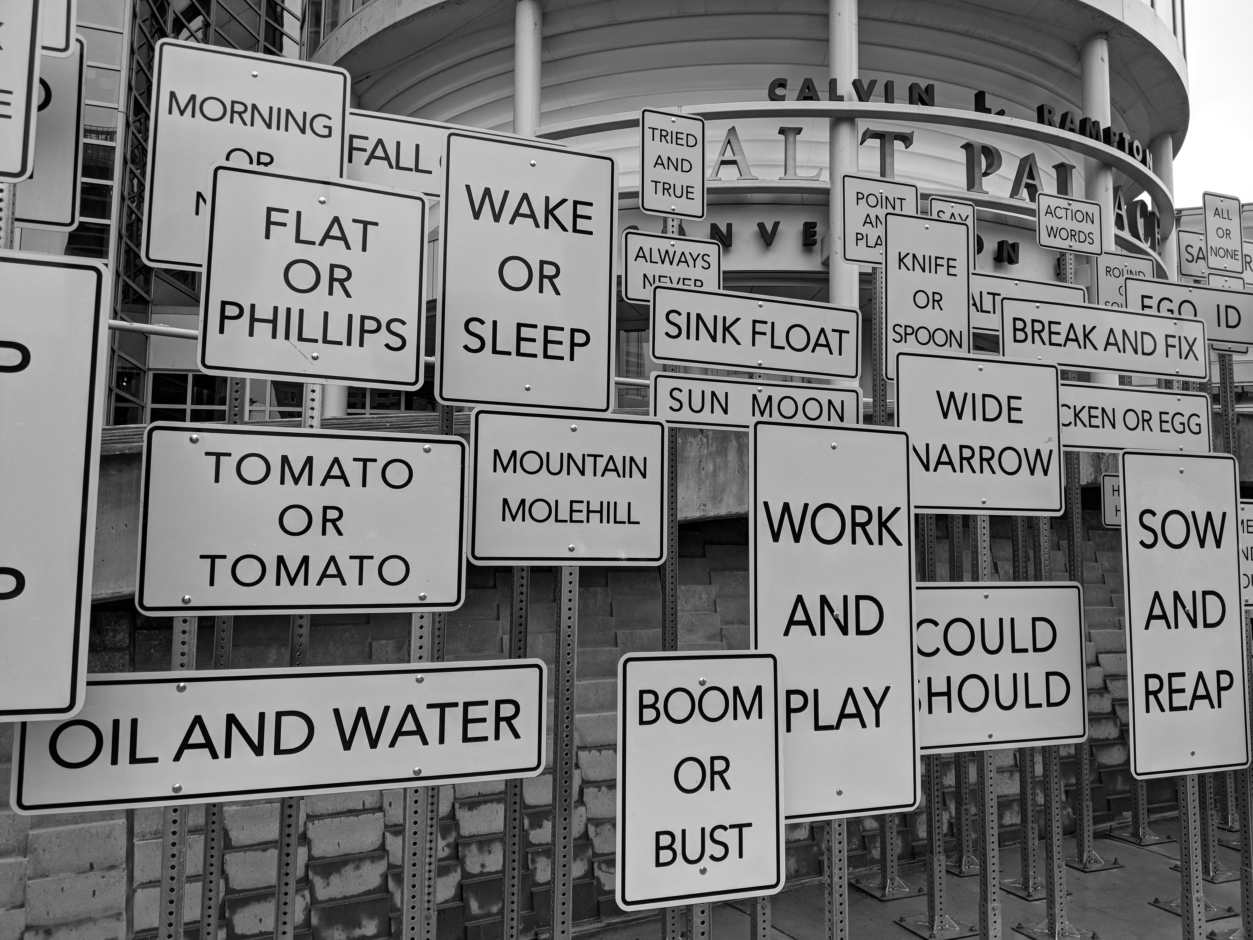 a bunch of signs that are in front of a building