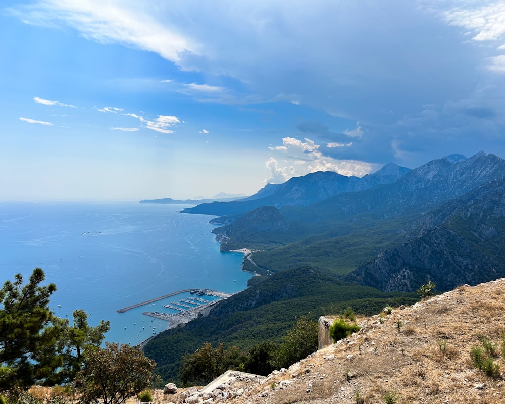 a scenic view of the ocean and mountains