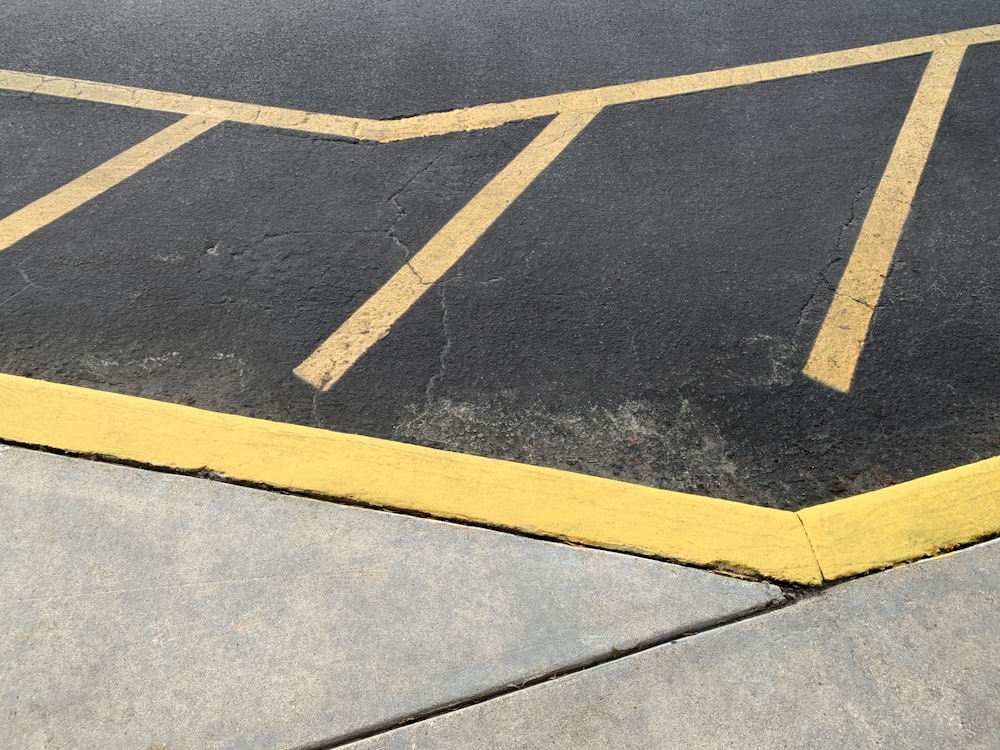a parking lot with yellow lines painted on it