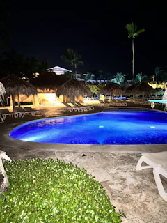 Evening shot of the resort pool area illuminated softly under the Florida twilight.