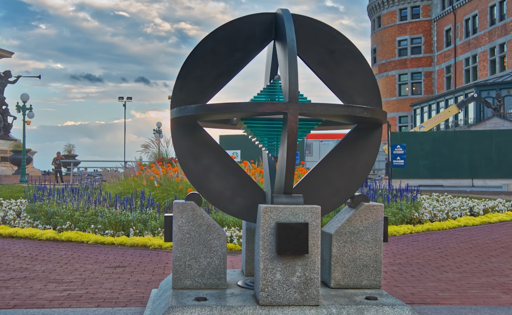 a statue of a star in the middle of a park