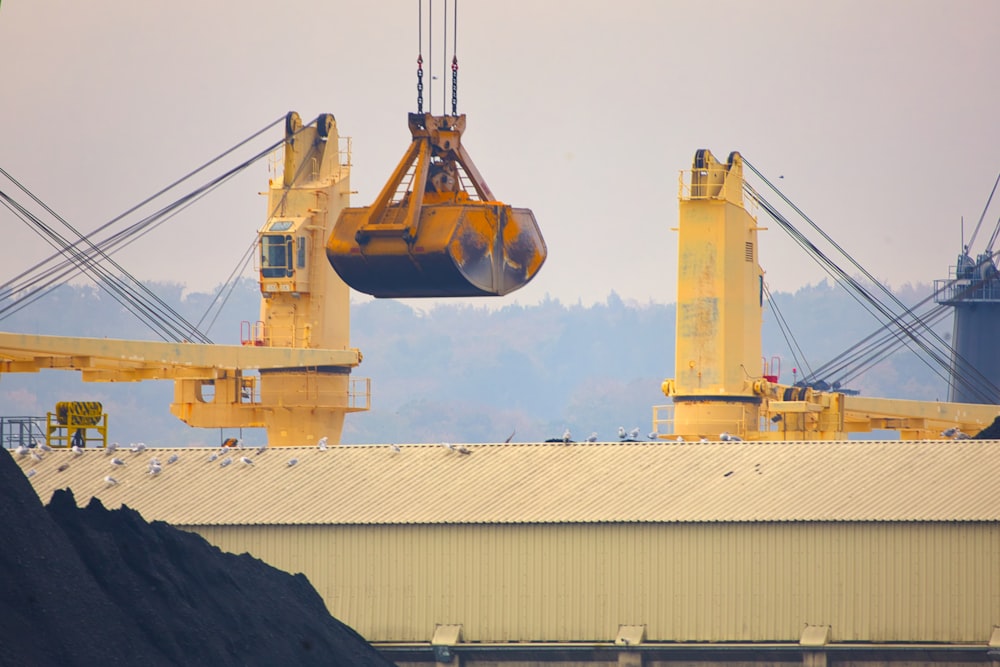 a crane is lifting a large piece of rock