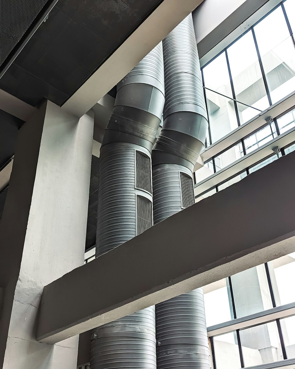 a bunch of metal pipes in a building