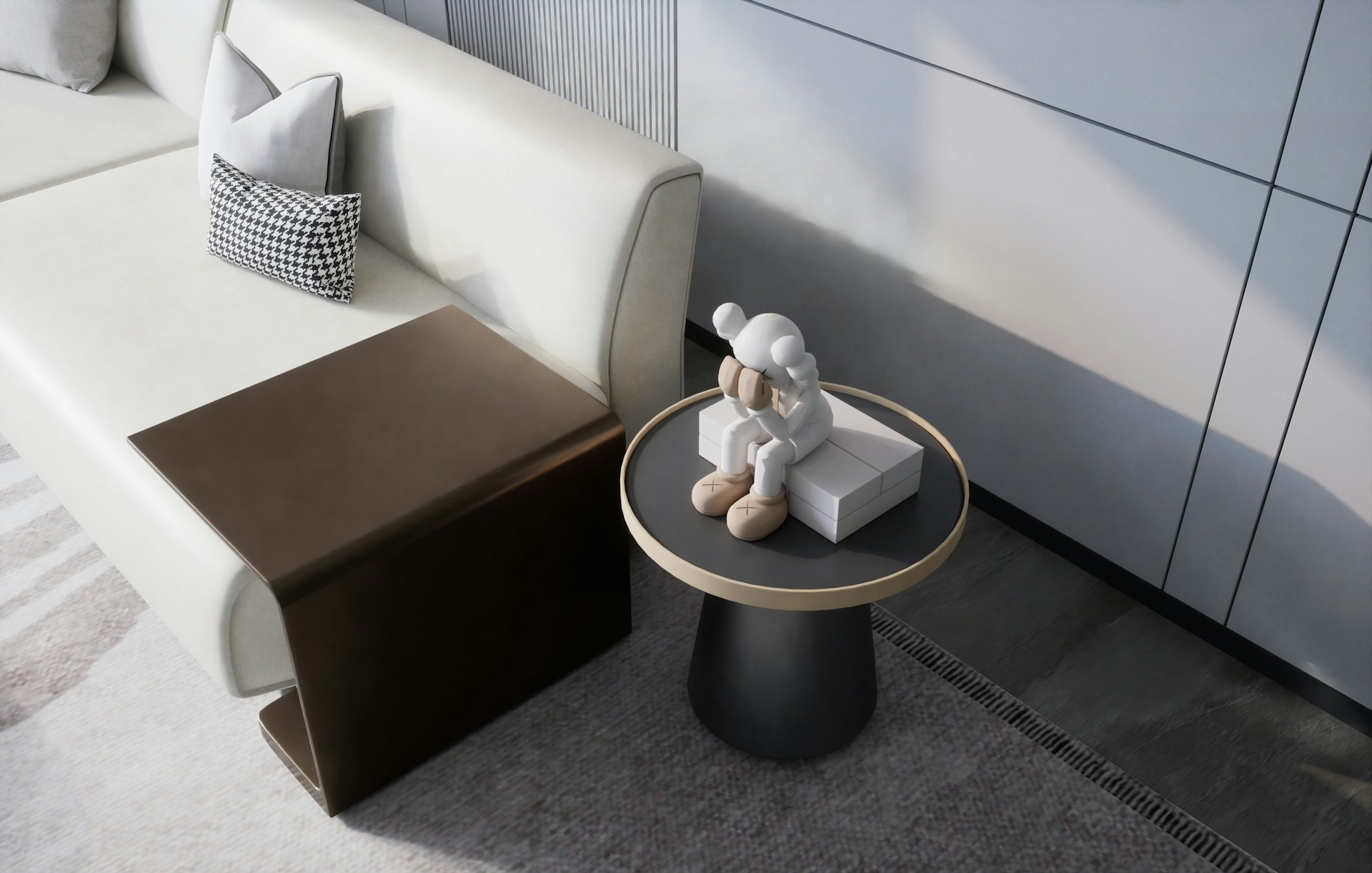 A modern living space features a light-colored sofa with geometric-patterned cushions. A small wooden side table is adjacent to the sofa, and a round side table holds a sitting statue in light tones, possibly resembling a character or figure.