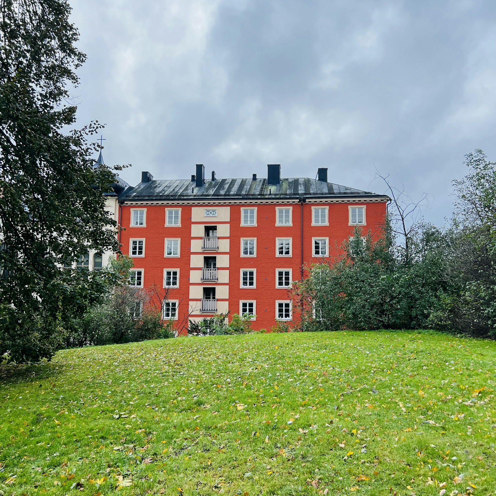 woman wearing yellow long-sleeved dress under white clouds and blue sky during daytime