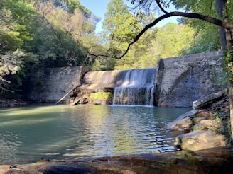 a large waterfall is coming out of the water